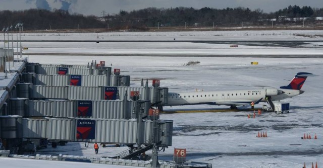 A lone plane sits at a gate at the Pittsburgh International Airport last month.