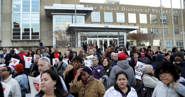 A crowd of teachers, parents, and community members rally outside the Philadelphia school district building where the School Reform Commission was meeting in November.